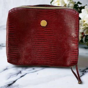 Vintage red Estée Lauder croc pattern case.